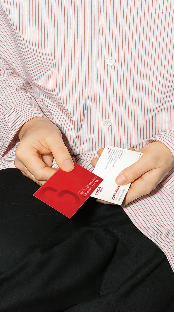 Boga Group business cards in hand