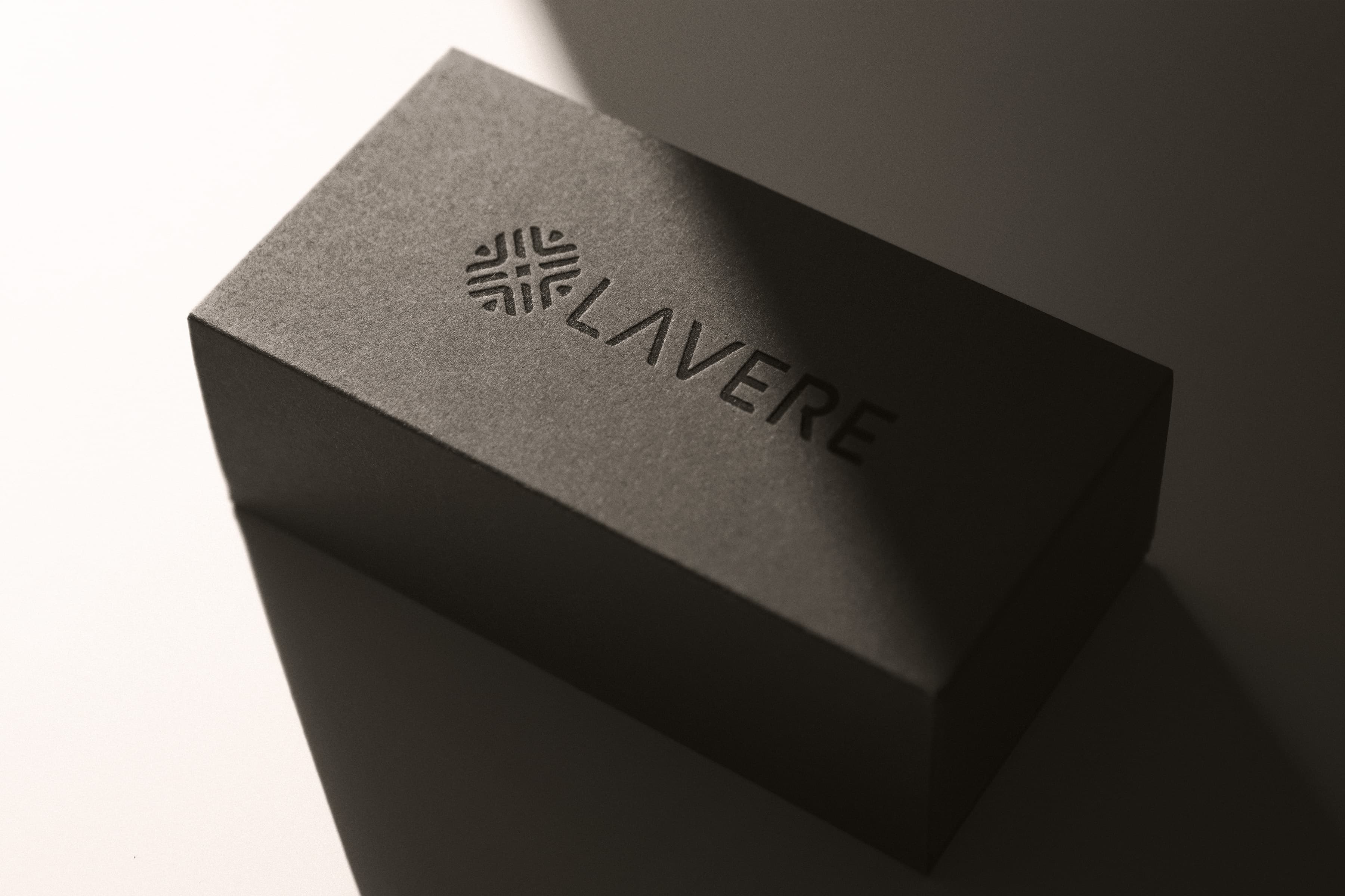 Monogram debossed on a black box